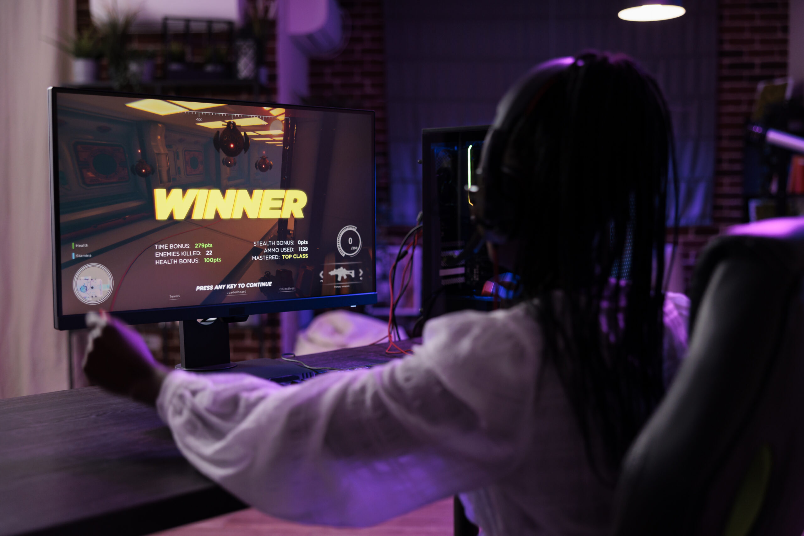 Content creator playing video games tournament on computer